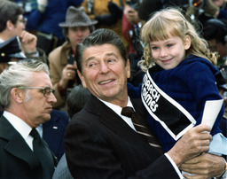 Photograph of Ronald Reagan holding Missy Jablonsky, Washington, D.C., 1980
