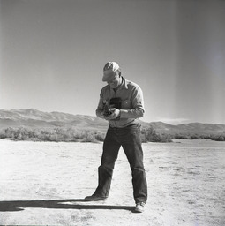 Man with camera, wild horse hunt
