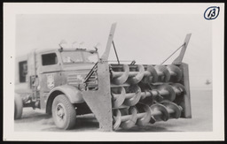 Snow removal blades attached to truck