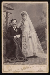 Unidentified man and woman in wedding garments