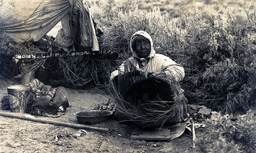 Indian woman weaving basket