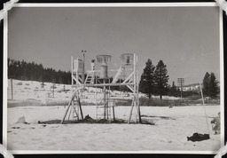 Snow monitoring station with shallow snow and worker, copy 2