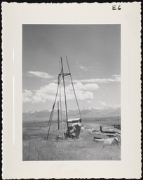 Worker constructing tripod for windmill, copy 1