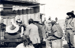 Group of Navajo beside a building