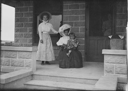 Women and child on porch