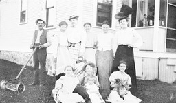 Group of people standing outside a house