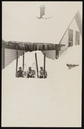 Skiers and snowshoer in deep snow