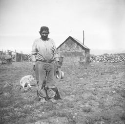 Paiute man with dog