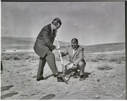 Peavine Damsite dedication, Alan Bible turning the first symbolic shovel of dirt with Bud Baker