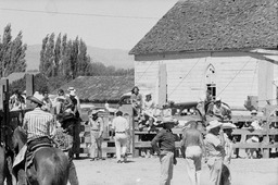 Group of people around a corral
