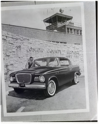 Man and car outside St Joseph County Airport, 1
