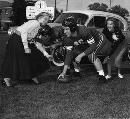 Football players with members of the Homecoming court, University of Nevada, 1955