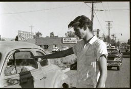James Cokinos with car