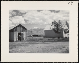 Worker with farm buildings, copy 2