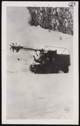Snow removal vehicle with extended arm