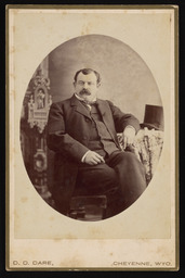 Unidentified man sitting at a table