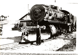 Lola L. Murrer posing in front of Southern Pacific Locomotive No. 2565 at the original Susanville depot (ca. 1914)