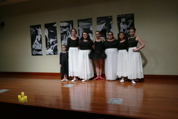 Dancers posing together onstage for photograph