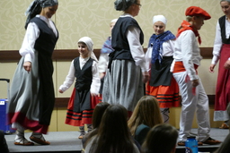 Dancers and children performing