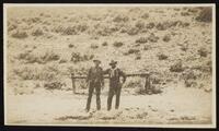 Two men standing in a snowstorm