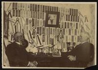 John Sparks at his desk with an employee circa 1900