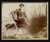 Unidentified man sitting in a buggy