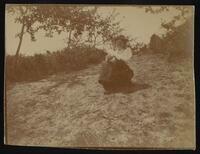 Woman sitting on a hill