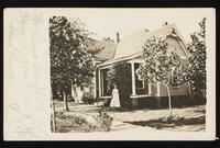 Laura Campbell in front of a house, Mineral Wells, Texas