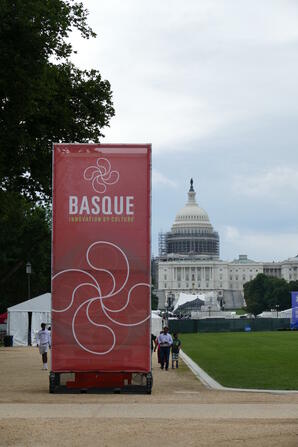 Smithsonian Folklife Festival event signage with Capitol Building