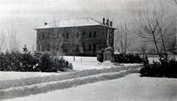 Winter on campus, Chemistry Building (historic) and Mackay Statue, ca. 1911