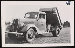 Truck with raised tipper mechanism