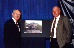 Photograph of Harry Reid with Unidentified Individual, Harry Reid Engineering Laboratory, Nevada, ca. 1991