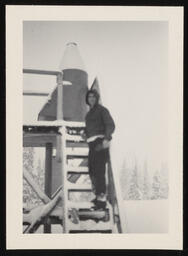 Ashton Codd walking up stairs to snow gauge, copy 4