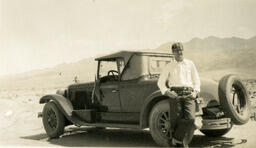 Man with automobile in the Nevada desert