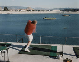 Aquarange, Hilton Bay, Reno, Nevada. Bill Benecke just completed his golf swing