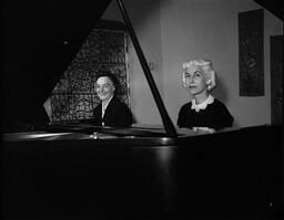 Alleta Gray and Helen Grimes playing the piano
