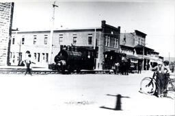 Construction locomotive being moved up Main Street in Susanville (ca. 1913)