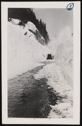 Trail cut through snow for road opening