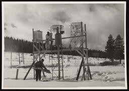 Snow station with two workers