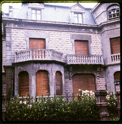 Boarded-up stone building