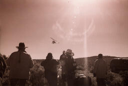 Photograph of BLM helicopter and spectators, Dann Ranch, February 11, 2003