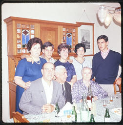 Group photo at home dinner table