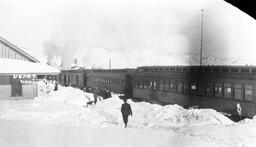 Virginia and Truckee passenger train at railroad depot in snow, Virginia City, Nevada, January, 1916