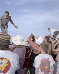 [four different views] Performers walking on fashion stage during Fashion Parade, Black Rock Desert, Burning Man festival