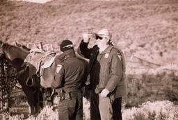 Photograph of conversing BLM agents, Dann Ranch, February 11, 2003